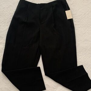 a. new day black trousers pleaded  tapered leg slim hip and thigh stretch